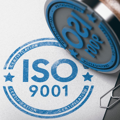 An ISO 9001 stamed onto a piece of paper